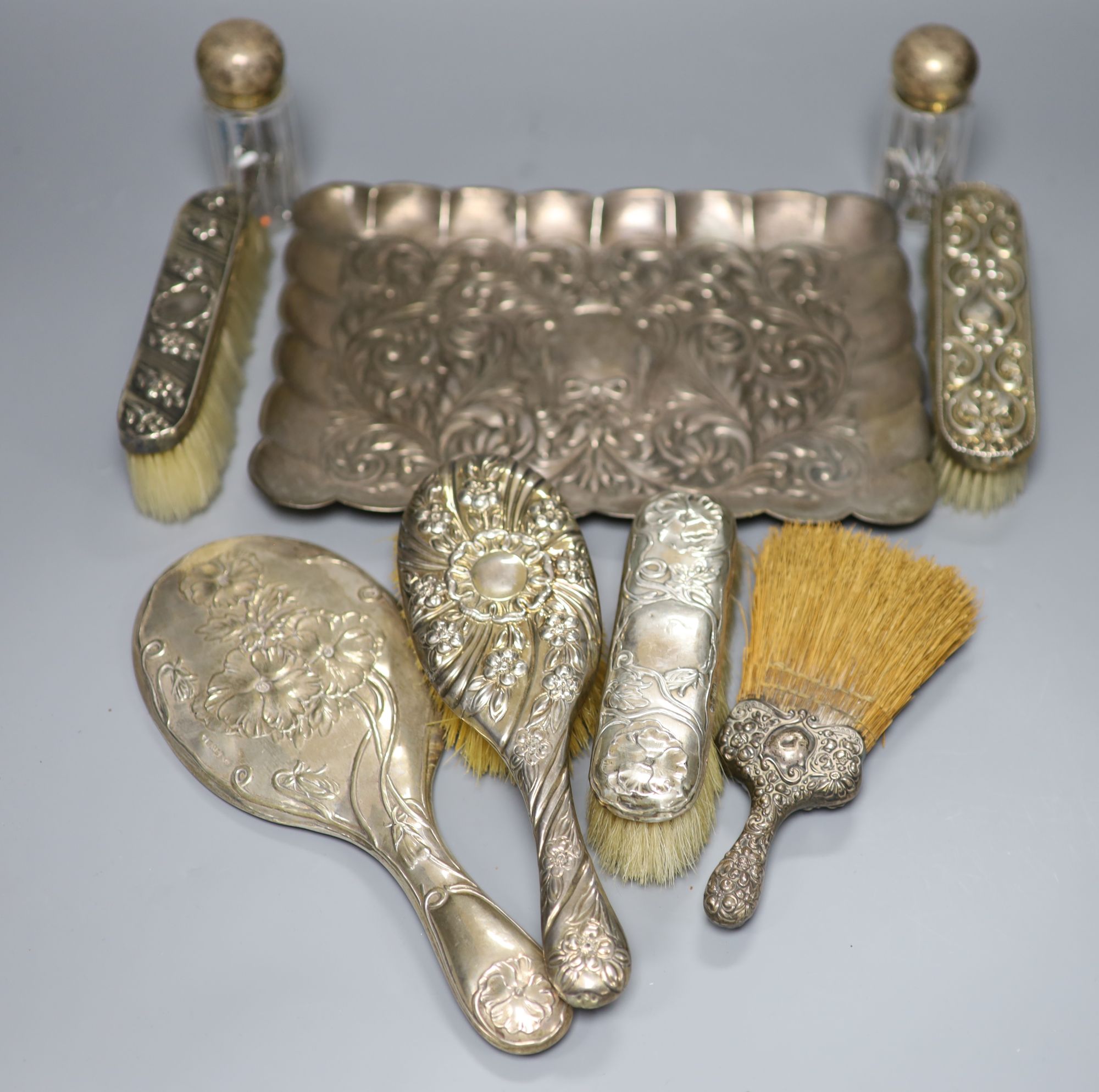 A Portuguese white metal dressing table tray(repairs), 28.2cm, gross 13oz & 8 other dressing table items.